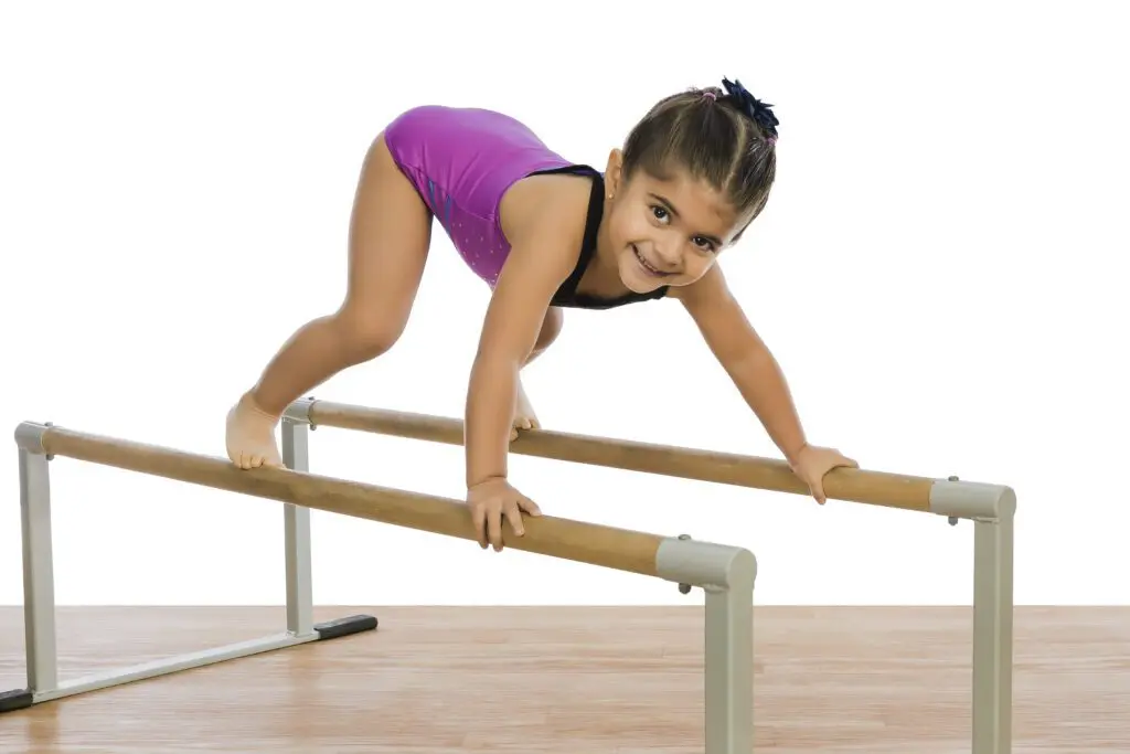 A girl at a balance rail
